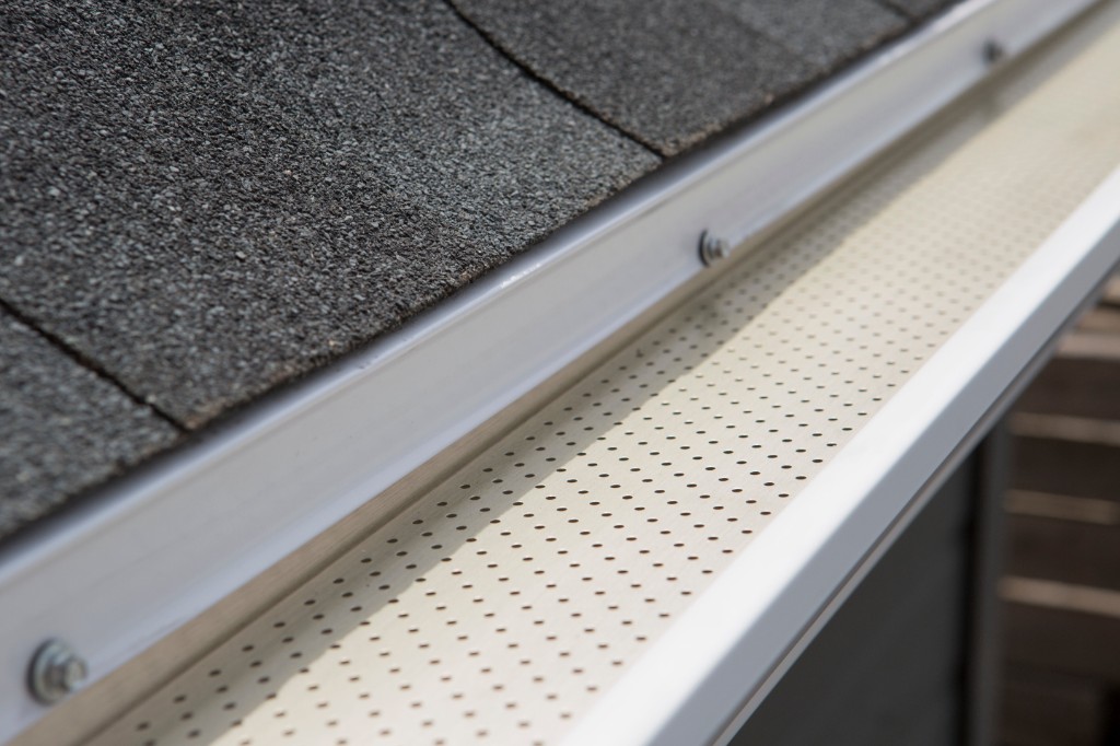 Close-up of Alu-Rex perforated gutter guard installed on a residential gutter