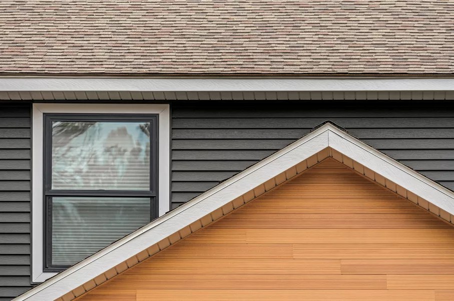 White fascia and soffit trim with lap siding on a modern home exterior